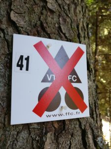 french cycling federation metal sign with a big red "x" through it