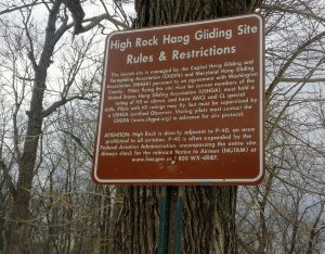 A sign with rules for hang gliders.